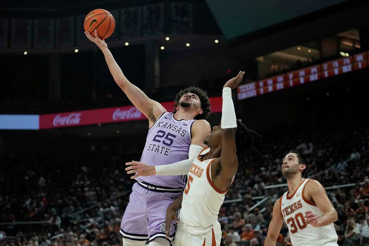 Kansas State forward Ismael Massoud shoots over Texas guard Marcus Carr during the first half of Tuesday night’s game in Austin.