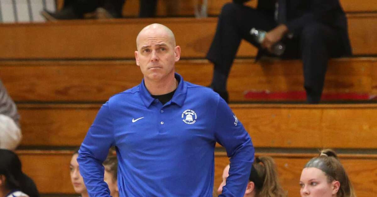 East Hampton High School girls varsity basketball Head Coach Shaun Russell on the sideline of the game in Cromwell against Morgan High School on Tuesday, Feb. 19.