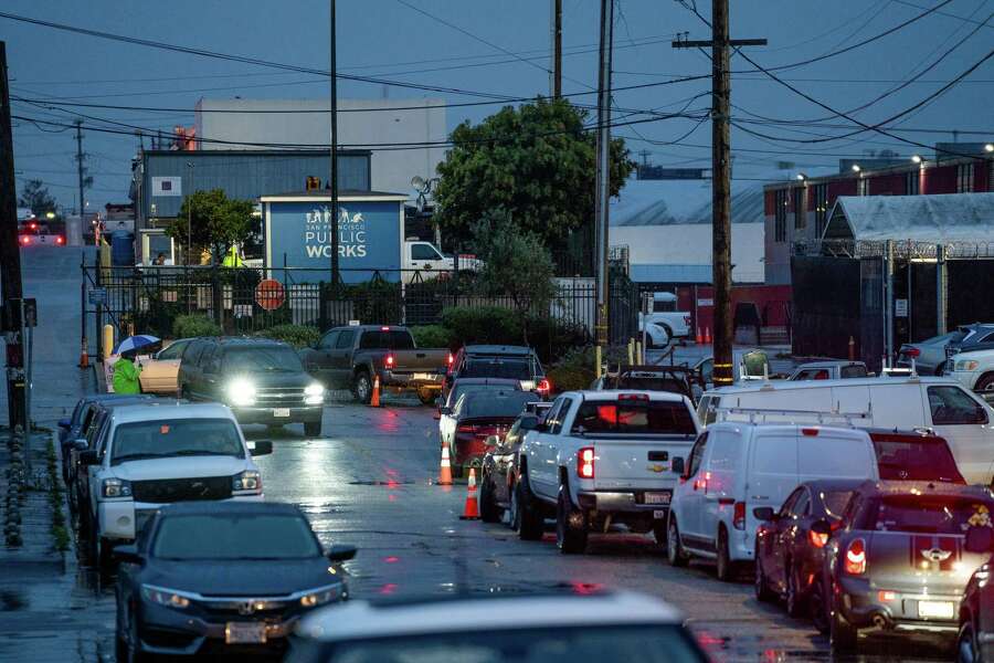 Around 30 cars line-up at San Francisco Public Works to get sand bags for the coming rain storm in San Franciscoon Wednesday, January 4, 2023. SF Public Works said it ran out of sand bags and won’t get any until noon.