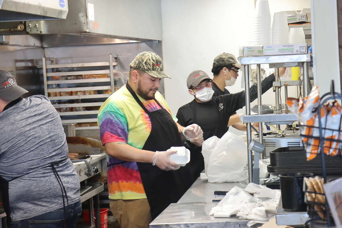 Employees put together lunch orders on Wednesday, Jan. 4, 2023, at Daddio's Burger in Beaumont.