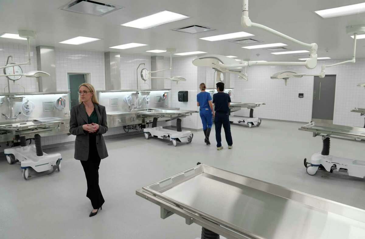 Galveston County Chief Medical Examiner Dr. Erin Barnhart talks about the autopsy room at the new Galveston County Medical Examiner's Office, 1205 Oak St., Wednesday, Jan. 4, 2023, in La Marque.