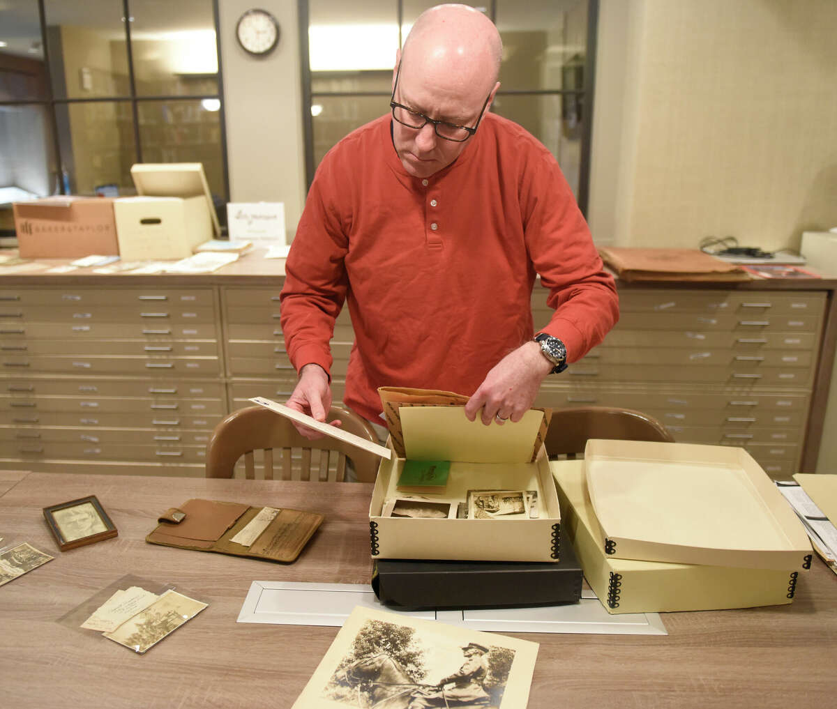 Christopher Shields, Curator of Library and Archives, shows artifacts from the life of John Henry Twachtman at the Greenwich Historical Society in Greenwich, Conn. Tuesday, Jan. 3, 2023. Original letters written by and to Twachtman, rare photographs from the Holley-MacRae papers, and other notes from primary sources will be on view during "Afternoon in the Archives: Twachtman in His Own Words," on Sunday, Jan. 8 at 2 p.m.
