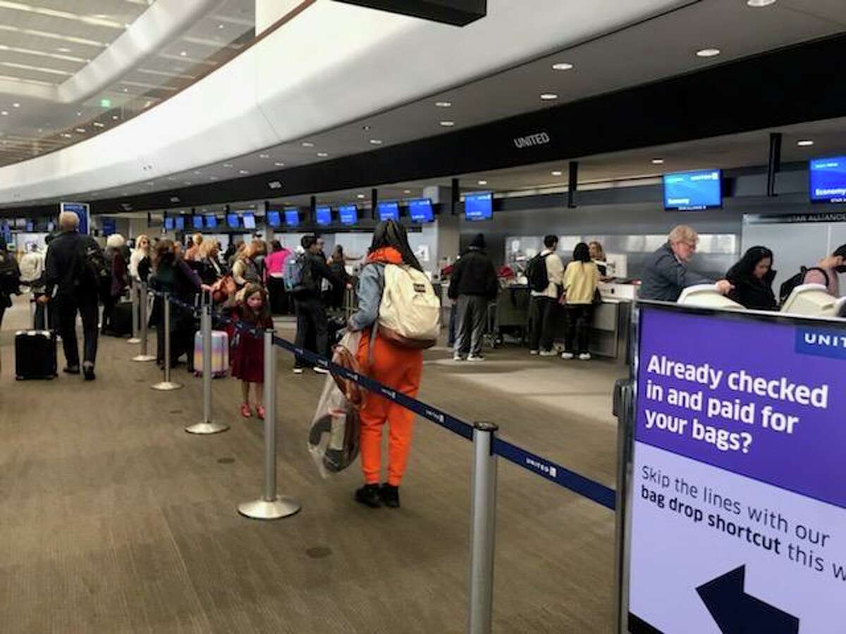 Passengers remained calm in line on Friday, Dec. 23, at San Francisco International Airport, despite some cancellations and delays caused by storms that have been snarling airports around others parts of the nation.