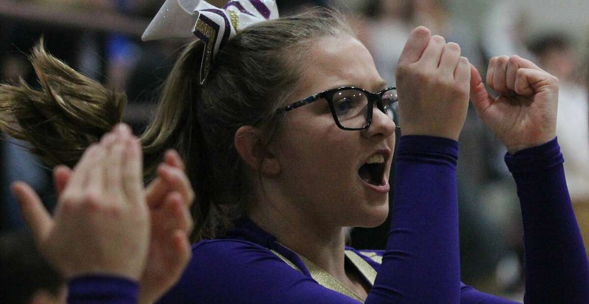 A Routt cheerleader cheers before the championship game of the Waverly Holiday Tournanament