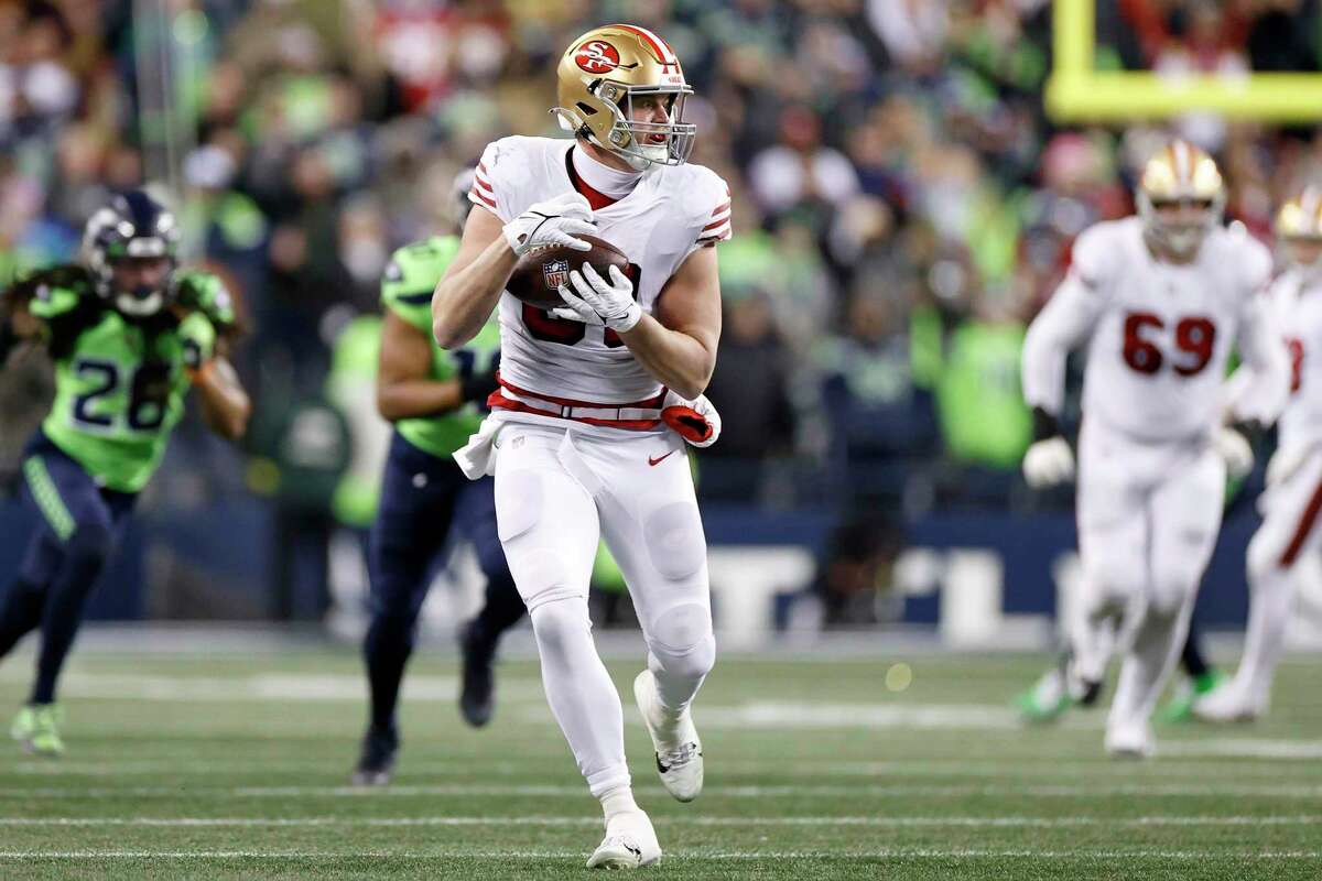 SEATTLE, WASHINGTON - DECEMBER 15: Tyler Kroft #81 of the San Francisco 49ers makes a reception against the Seattle Seahawks during the fourth quarter of the game at Lumen Field on December 15, 2022 in Seattle, Washington. (Photo by Steph Chambers/Getty Images)