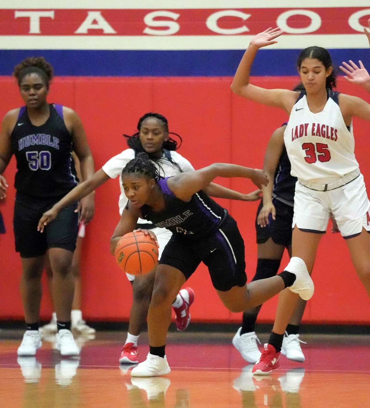 Humble High School's Dawn Roberson (1) grabs a rebound during the second half of a District 21-6A high school girls basketball game at Atascocita High School on Wednesday, Jan. 4, 2023 in Humble.