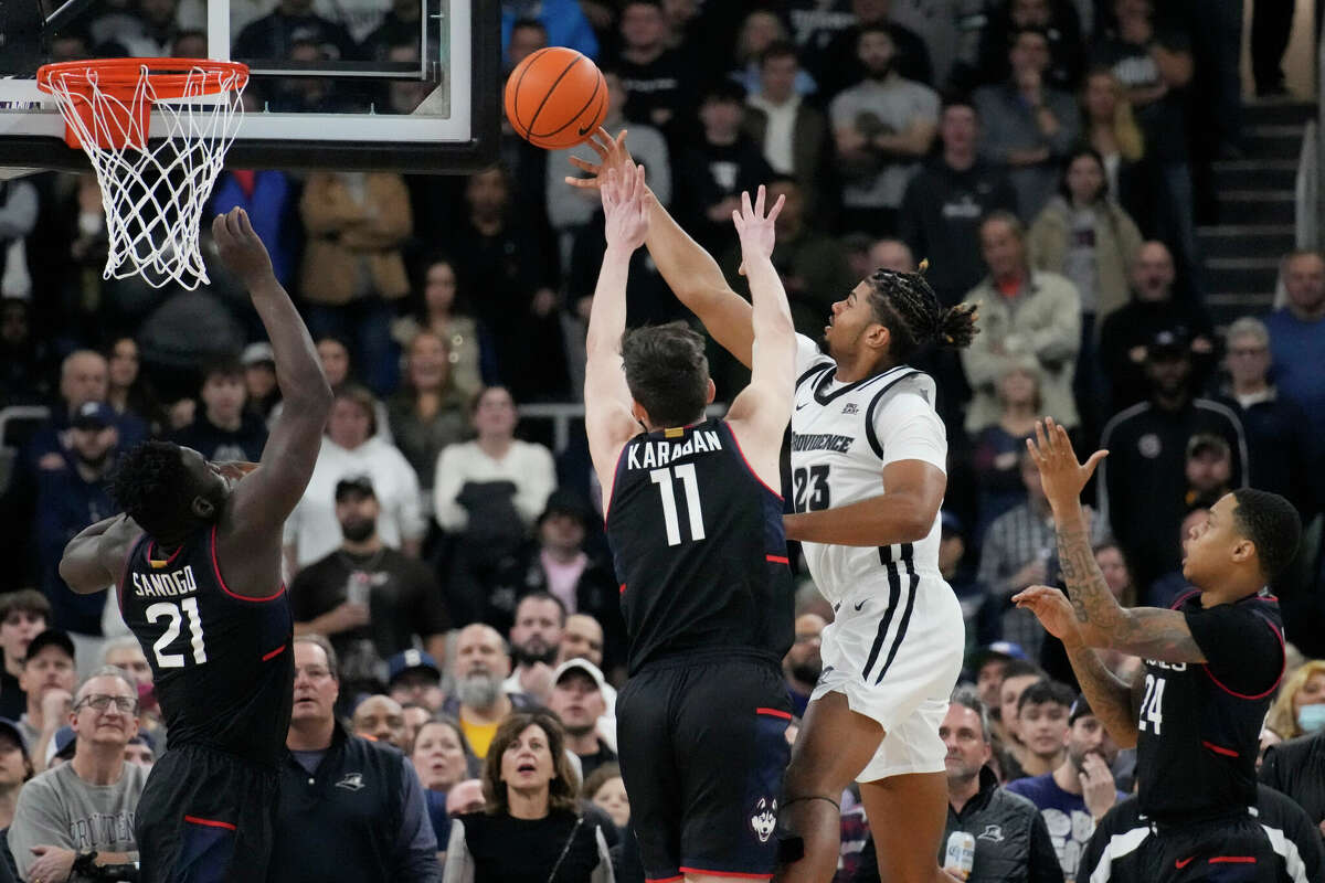 Providence forward Bryce Hopkins (23) drives to the basket against the Connecticut during the first half of an NCAA college basketball game, Wednesday, Jan. 4, 2023, in Providence, R.I. (AP Photo/Charles Krupa)
