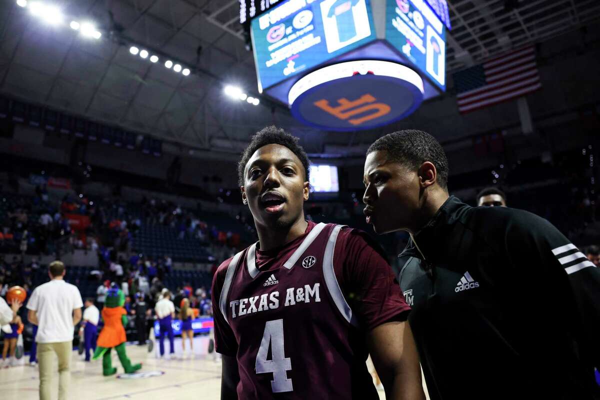 GAINESVILLE, FLORIDA - JANUARY 04: Wade Taylor IV #4 of the Texas A&M Aggies reacts after defeating the Florida Gators 66-63 in a game at the Stephen C. O'Connell Center on January 04, 2023 in Gainesville, Florida.