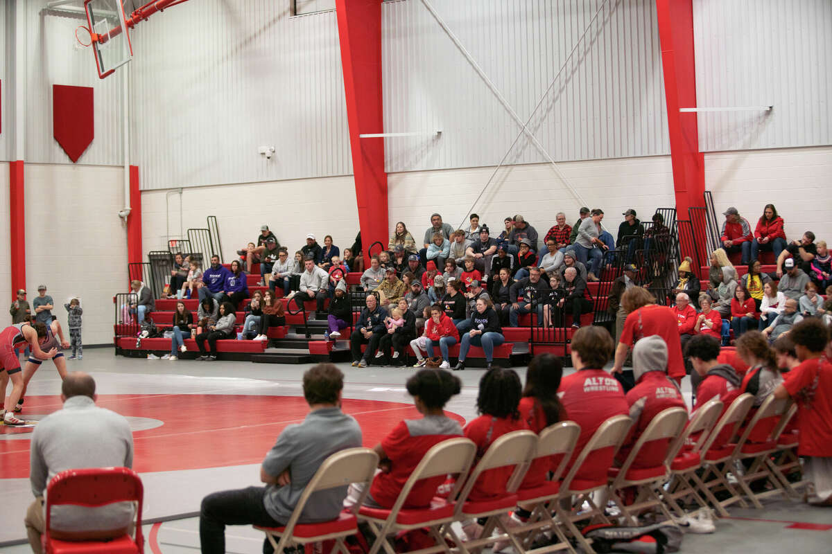 Fans watch the action as Alton takes on Collinsville Wednesday night in a Southwestern Conference dual match in the new auxiliary gym facility at AHS.