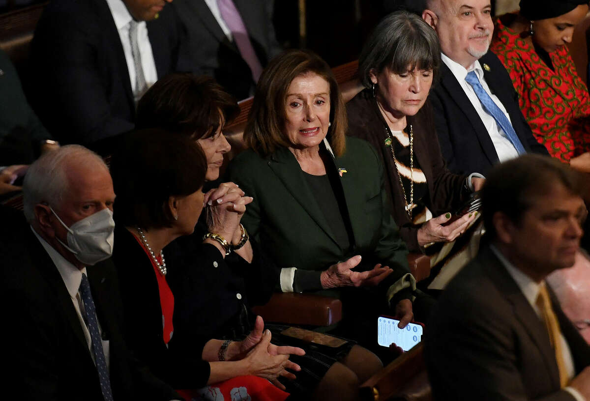 Outgoing U.S. House Speaker Nancy Pelosi (center) speaks with colleagues as the House of Representatives continues voting for new speaker at the U.S. Capitol in Washington, D.C., Wednesday, Jan. 4, 2023. 