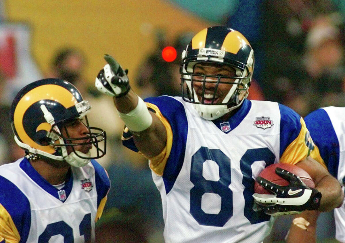 St. Louis Rams Torry Holt (88) celebrates a 10-yard touchdown in the third quarter as teammate Isaac Bruce (80) looks on during Super Bowl XXXIV at the Georgia Dome in Atlanta Sunday, Jan. 30, 2000. Torry Holt is a finalist for the Pro Football Hall of Fame's class of 2022. 