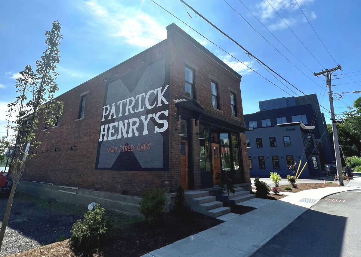 The tavern Patrick Henry's, at 48 S. River St., Coxsackie, is part of the redevelopment of a former industrial property on the Hudson River waterfront. The tavern will be operated by Dominick Purnomo, of Yono's and dp: An American Brasserie in Albany. He will also run the rooftop restaurant in the new James Newbury Hotel, seen in the background. Patrick Henry's is due to open in late January 2023, with the hotel and restaurant opening around the beginning of June. 