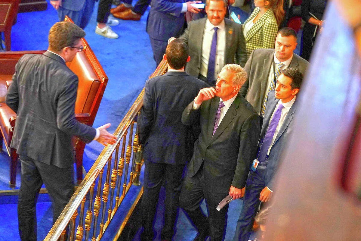 Rep. Kevin McCarthy, R-California, leaves the floor after the House adjourned after trying to elect a speaker and convene the 118th Congress.