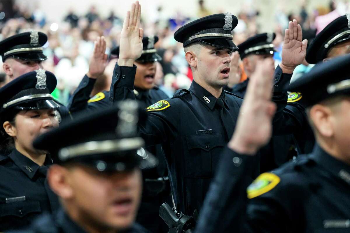 New police offices take their oath of office during the Houston Police Academy graduation of Cadet Class 256 on Jan. 5. The city's three pension systems -- for police officers, firefighters and municipal employees -- face far brighter futures after a series of reforms in Mayor Sylvester Turner's first term.