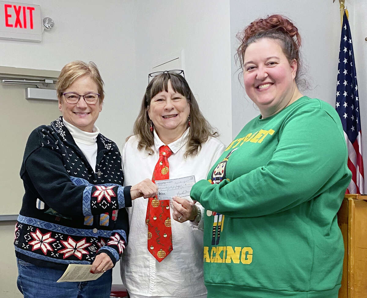 Sue Ann Mullen (center) of Ambucs presents a check to Peggy Davidsmeyer (left), executive director of Jacksonville Area Center for Independent Living; and Heather Knapp, a JACIL independent living advocate. The check represents a donation from Ambucs to help support JACIL’s efforts.