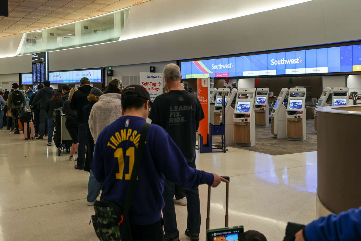 Passengers lined up by the Southwest Airlines counter at SFO on Dec. 26, 2022.