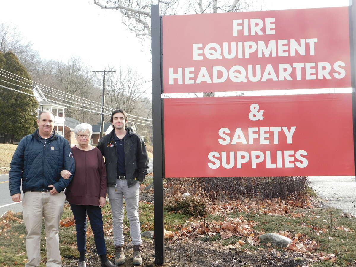 Fire Equipment Headquarters in Torrington was recognized for its 50th year in business. From left are owners Tim O'Sullivan, his mother, Mary Ann O'Sullivan, and his son, Timmy O'Sullivan. 
