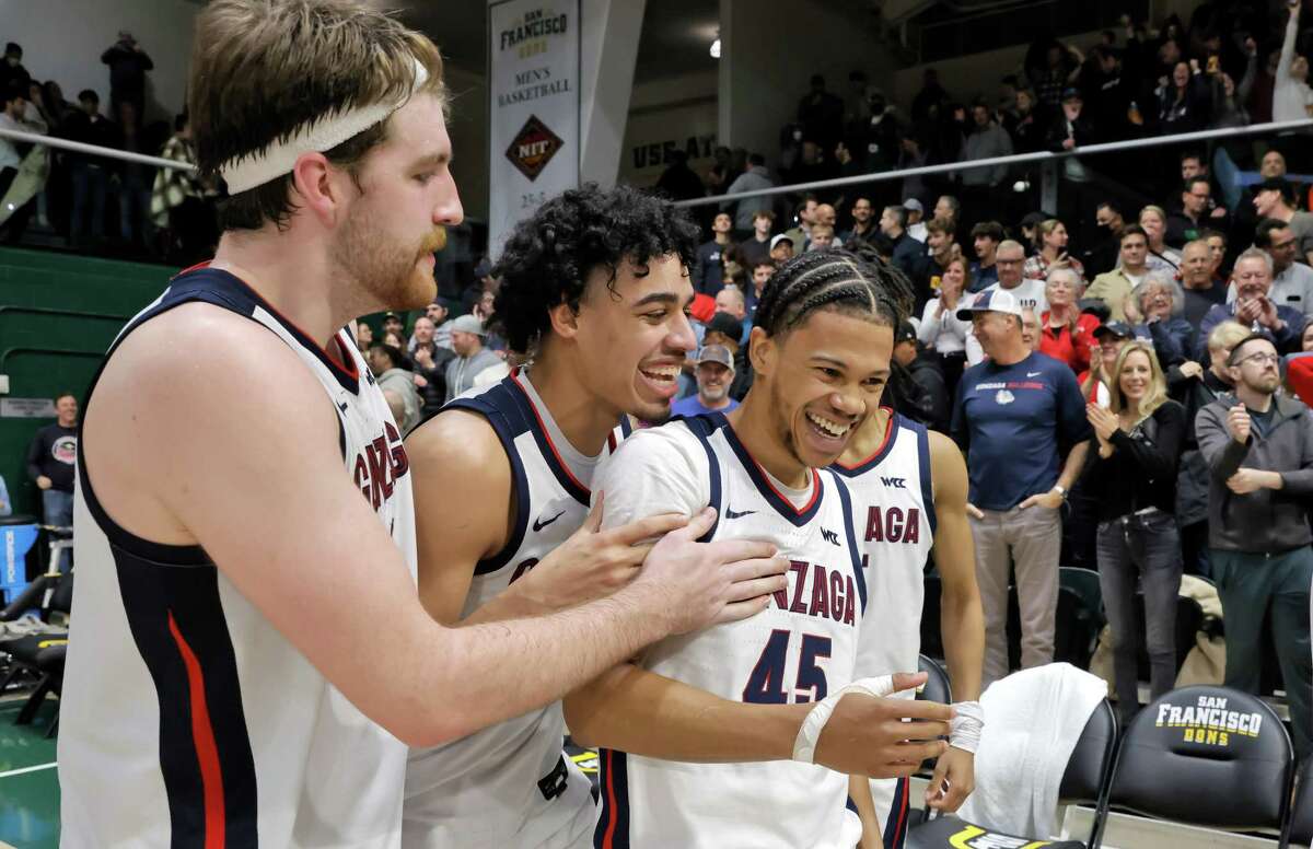 Gonzaga teammates celebrate with Rasir Bolton (45) after the Gonzaga Bulldogs defeated the USF Dons 77-75 at Memorial Gym in San Francsico, Calif., on Thursday, January 05, 2023.