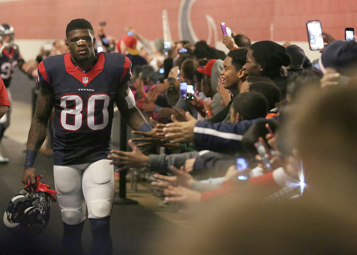 Andre Johnson #80 of the Houston Texans shakes hands with fans before playing the Jacksonville Jaguars in a NFL game on December 28, 2014 at NRG Stadium in Houston.