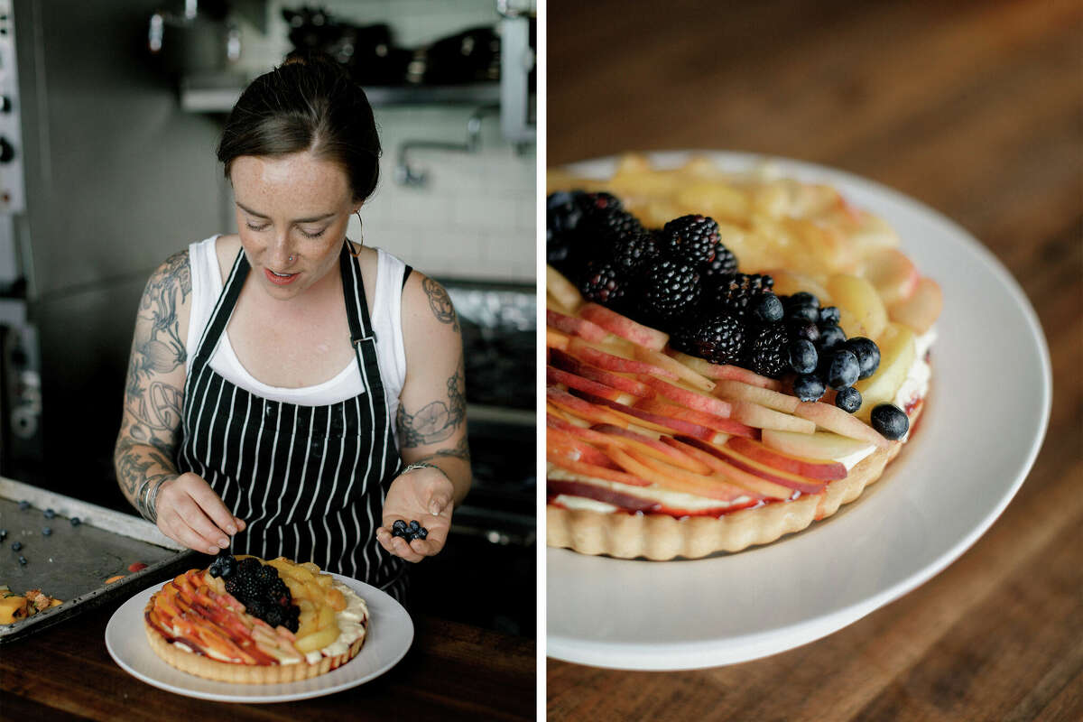 Hannah Buoye, a former pastry chef who now works in a bakery, tops a tart with fresh fruit.