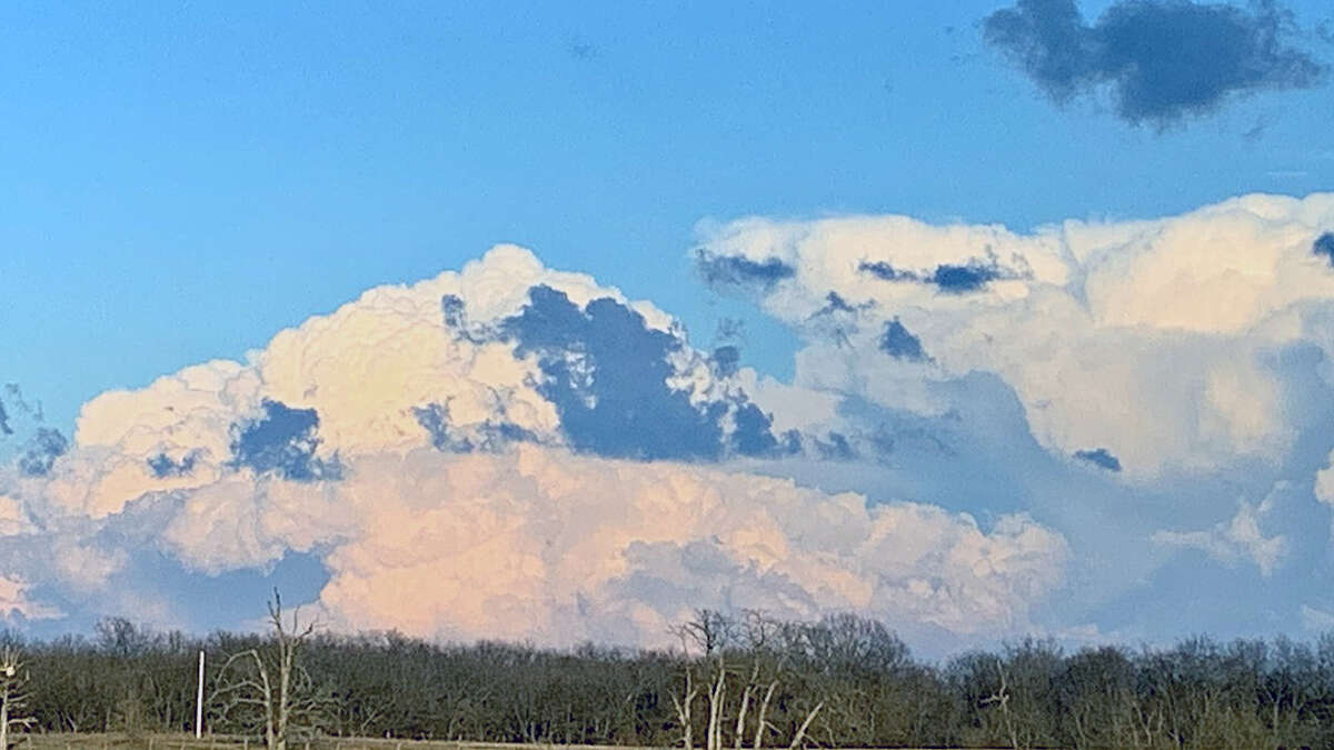 Large, fluffy clouds give the illusion of a snow-covered mountain in west-central Illinois.
