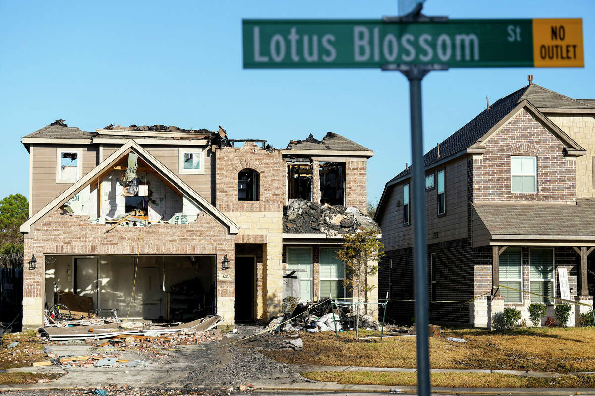 The burned out shell of the home, that the day before was the scene of a standoff with police and fire, in the 3200 block of Lotus Blossom is shown on Friday, Jan. 6, 2023 in Spring. A man already accused of arson and aggravated assault now faces terrorist threat against police officer charges after barricading himself inside the house in Spring that was later destroyed in a fire Thursday.