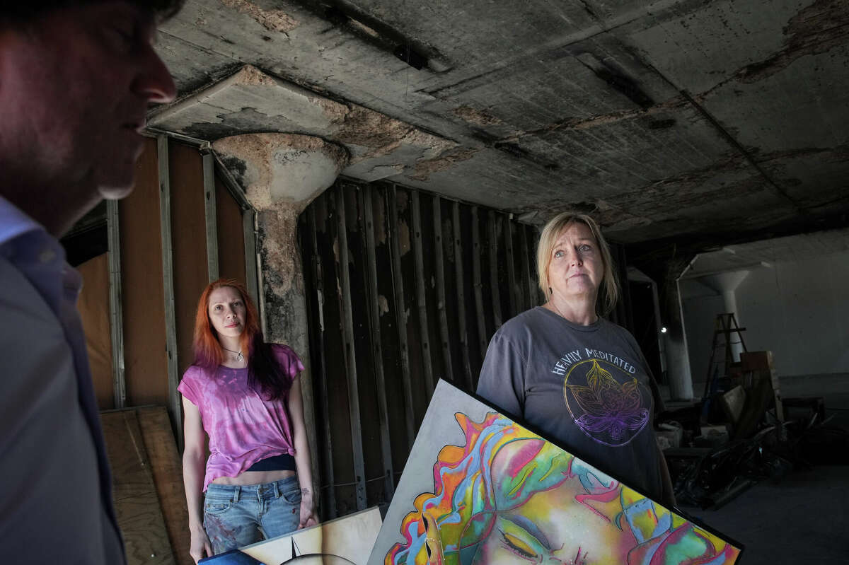 Artists Toria Hill, right, and Rebekah Molander talk with building owner Jon Deal as they walk through the fire-damaged space that once housed their art studios Friday, Jan. 6, 2023, at Winter Street Studios in Houston. Investigators believe a fire was intentionally set in the building. âI could give you all kinds of adjectives, but itâs not good,â Deal said of the fire.