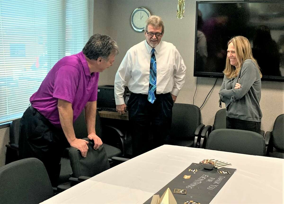 Madison County Safety and Risk Manager Stacey Perjak stopped by the Chief Assessment Office to congratulate Chief Assessor Joe Dauderman, center, and Deputy Assessor Phil Byers  on Friday to congratulate on their retirements. Dauderman will retire at the end of February and Byers worked his last day on Friday.