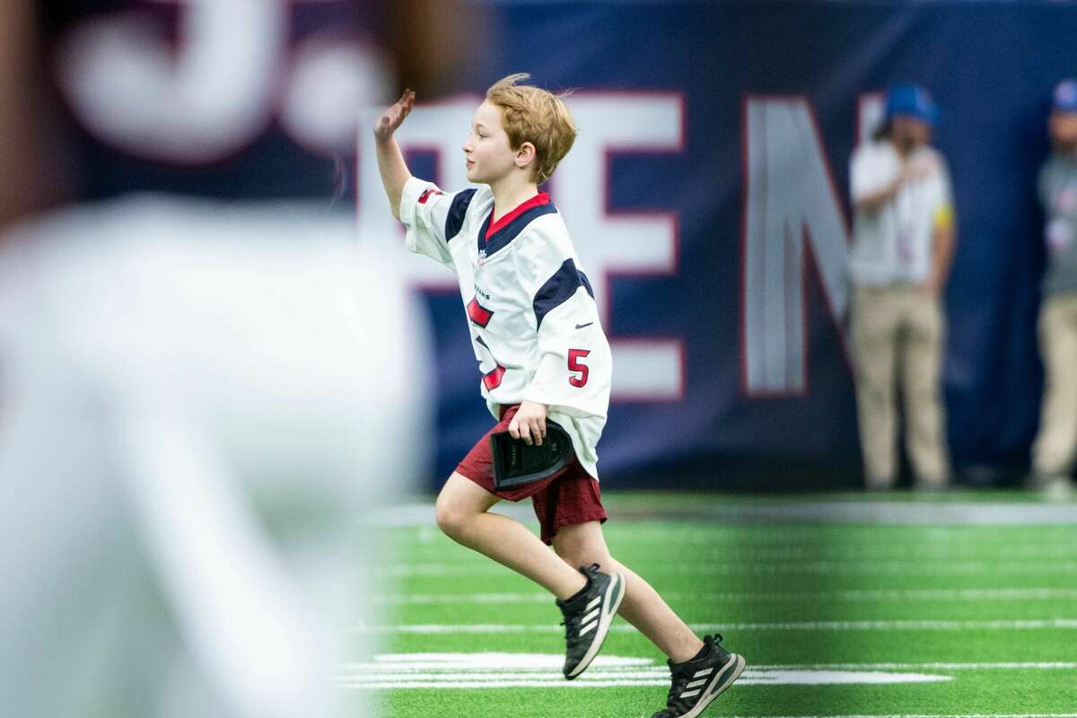 10-year-old Kickoff Kid Parker Chatham at the Houston Texans vs. Jacksonville Jaguars matchup on Sunday, Jan. 1, 2023.