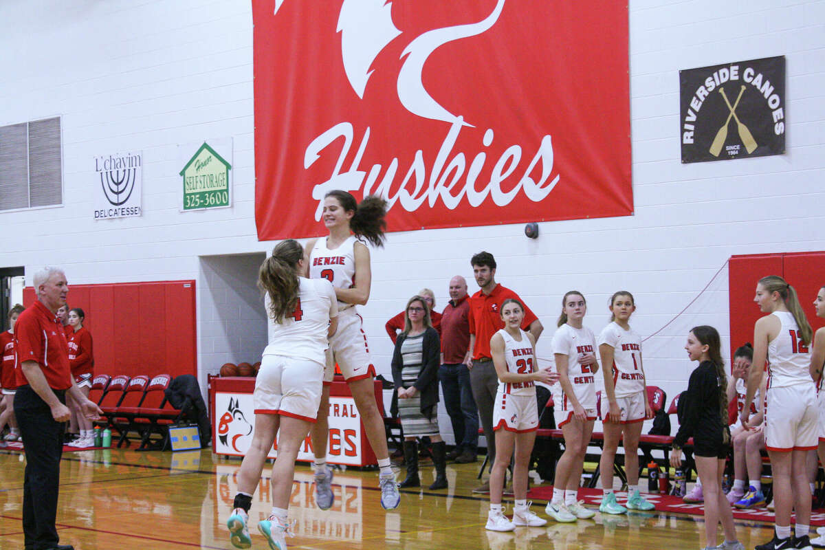 Benzie Central senior Gloria Stepanovich (2) and junior Natalie Rucki (4) go trhough their routine during starting lineups against Suttons Bay on Jan. 6 at Benzie Central Middle School. 