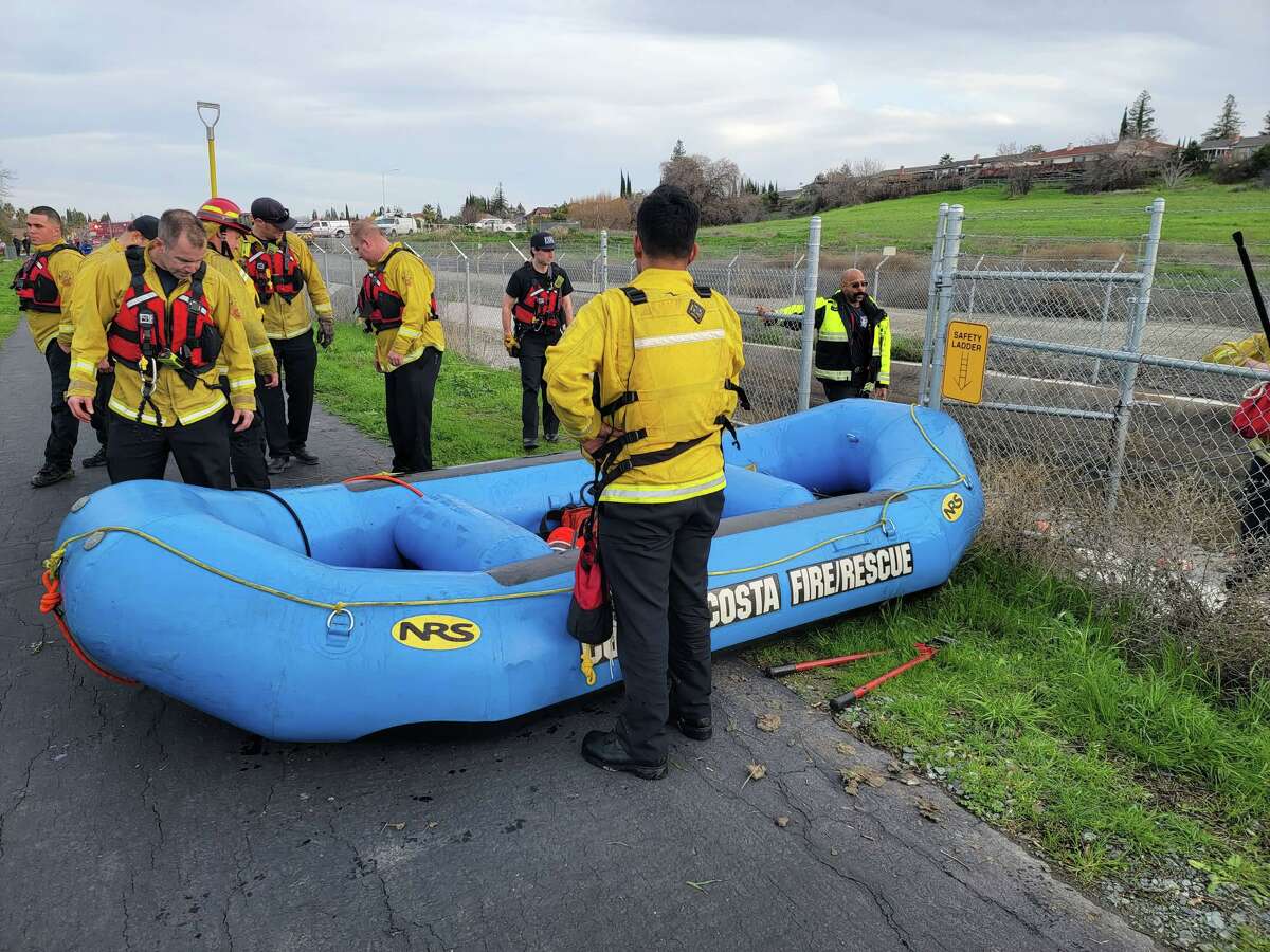 Contra Costa firefighters gather for a rescue mission near the Contra Costa Canal on Friday, Jan. 6, 2023