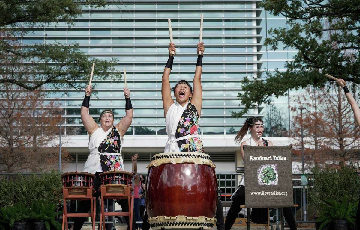 Japanese drumming ensemble, Kaminari Taiko, perform for people coming together to celebrate the Japanese New Year on Saturday, Jan. 7, 2023 at Levy Park Pavilion in Houston.