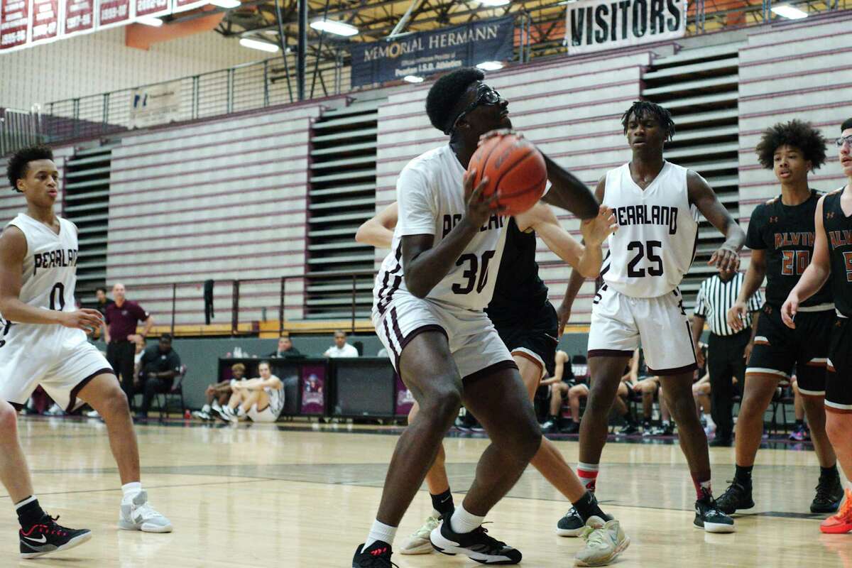 Pearland’s Ezenna Ibe (30) looks to put up a shot against Alvin Saturday, Jan. 7, 2023 at Pearland High School.