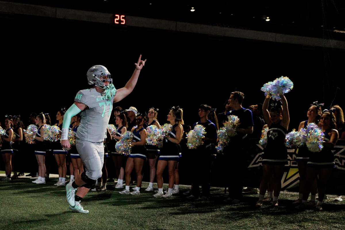 West’s Colton Thomasson (77), a Smithson Valley High School offensive tackle who signed with the Texas A&M Aggies, runs out of the tunnel during the 2023 All American Bowl pregame show at the Alamodome in San Antonio, Texas, Saturday, Jan. 7, 2023.