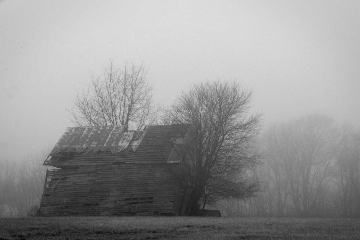 Fog adds a wintry touch to a leaning barn in rural Morgan County.