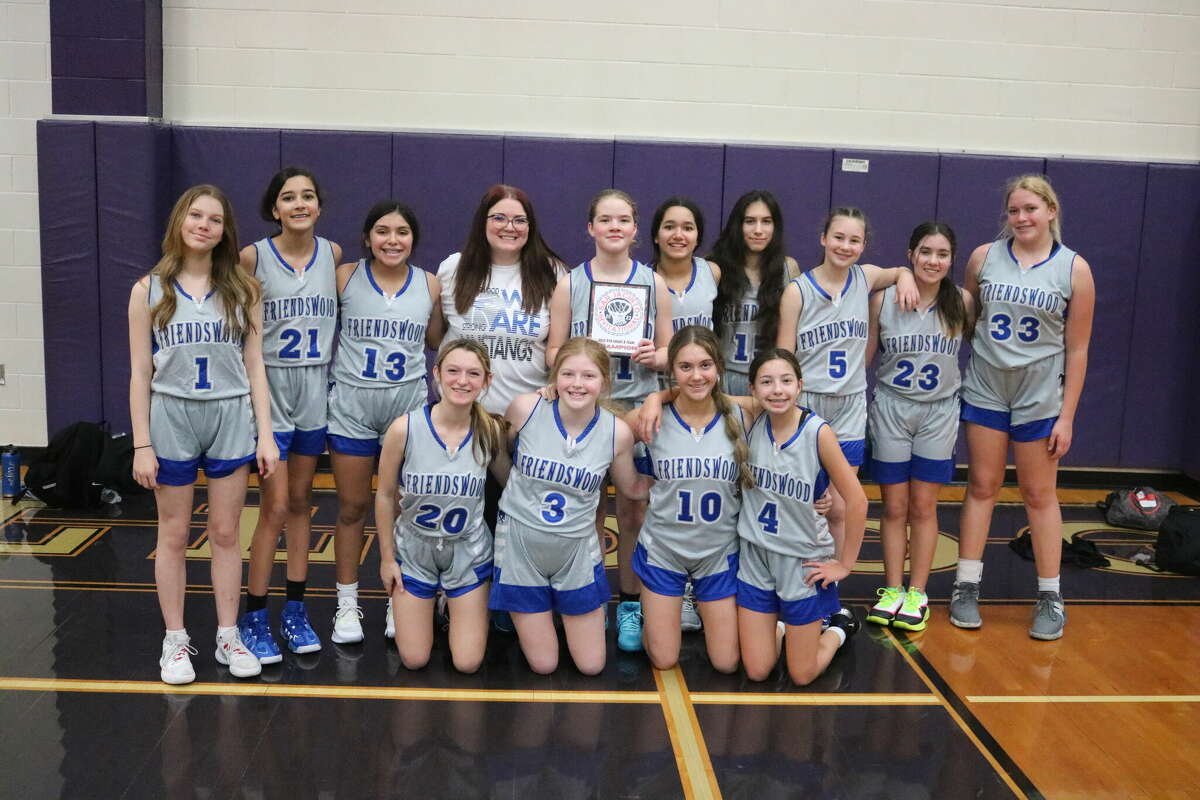 The Friendswood Junior High 8B girls basketball team is all smiles after they won the 16-team San Jacinto Invitational in Pasadena Saturday afternoon.