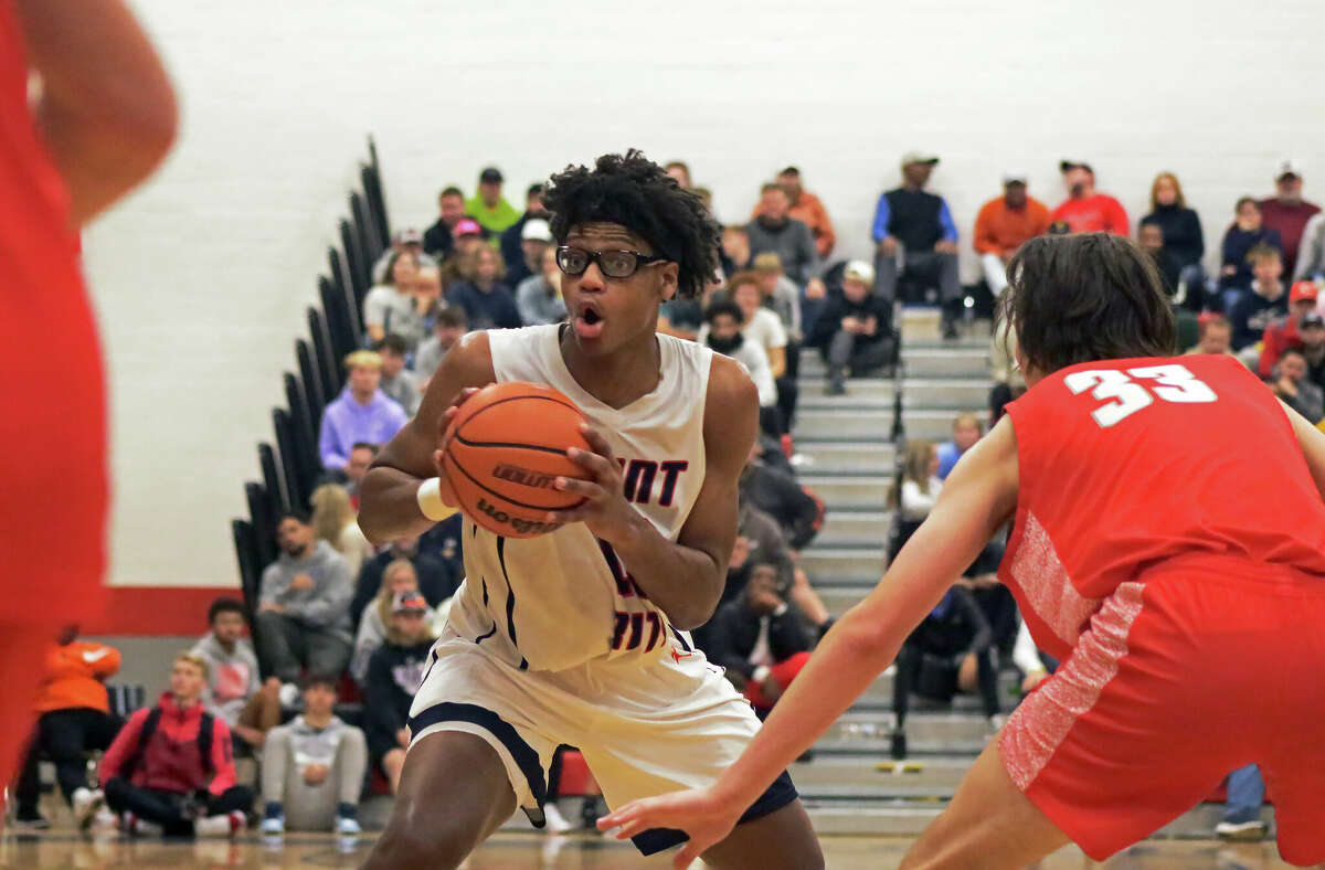 St. Rita's James Brown pump fakes against Chaminade at the Highland Shootout on Saturday. The North Carolina commit is nationally ranked as the 27th best player in the country.