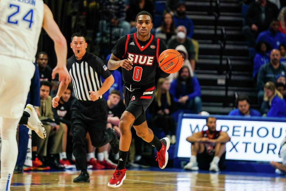 SIUE's Damarco Minor dribbles down the court against Southern Indiana on Saturday. Minor scored 27 points and grabbed 11 rebounds in the Cougars' 69-62 road win. 