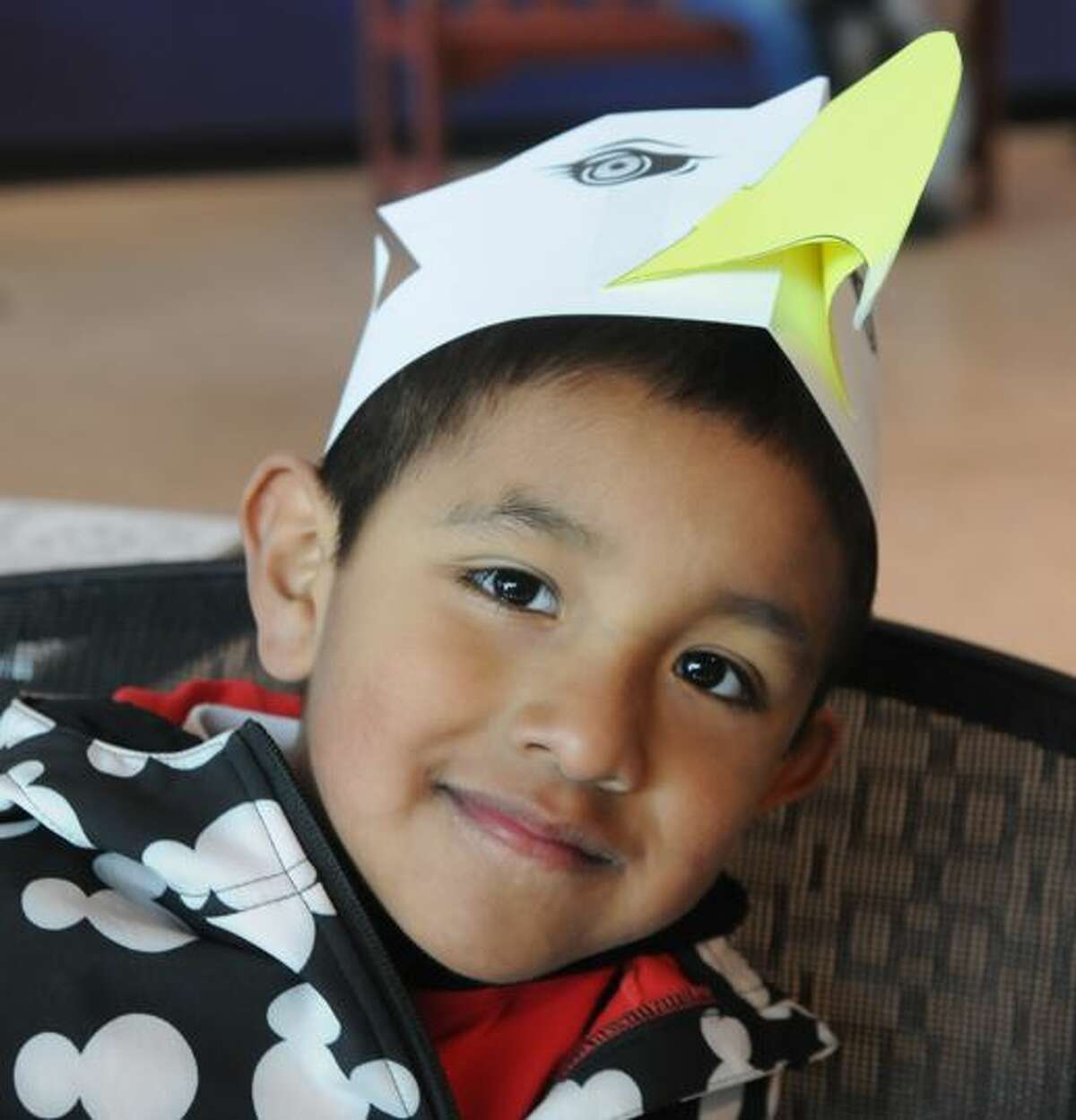 Six-year-old Marco Beltran of Hoffman Estates, Illinois proudly displays the eagle hat he made at the National Great Rivers Museum on Saturday during Alton's annual Eagle Ice Festival.