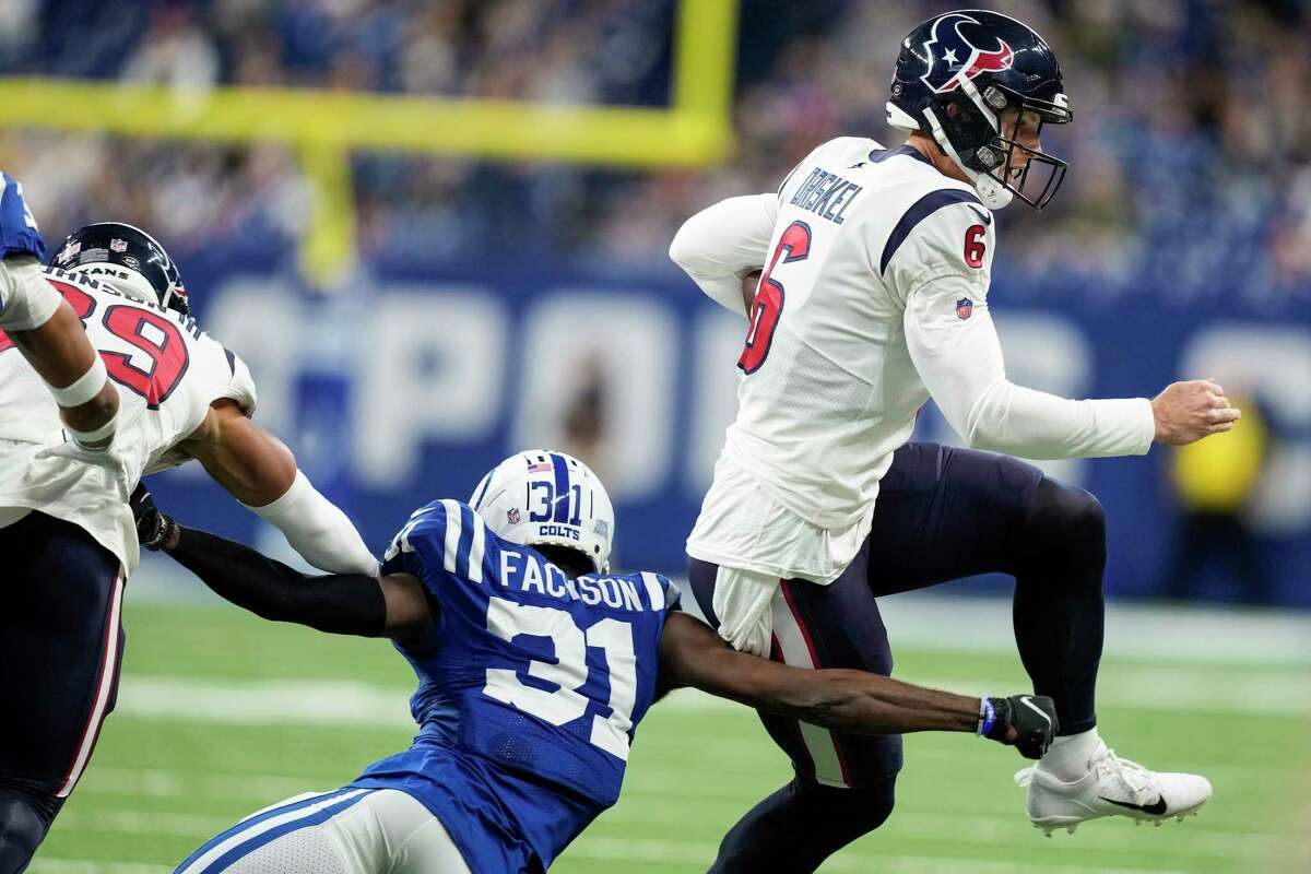 Houston Texans quarterback Jeff Driskel (6) is forced out of bounds by Indianapolis Colts safety Brandon Facyson (31) during the first half of an NFL football game Sunday, Jan. 8, 2023, in Indianapolis.