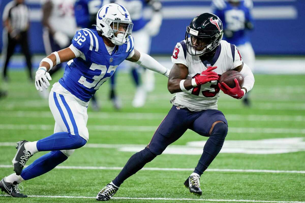 Jan 8, 2023; Indianapolis, Indiana, USA; Houston Texans wide receiver Brandin Cooks (13) runs the ball while Indianapolis Colts safety Julian Blackmon (32) defends in the first quarter at Lucas Oil Stadium. Mandatory Credit: Trevor Ruszkowski-USA TODAY Sports