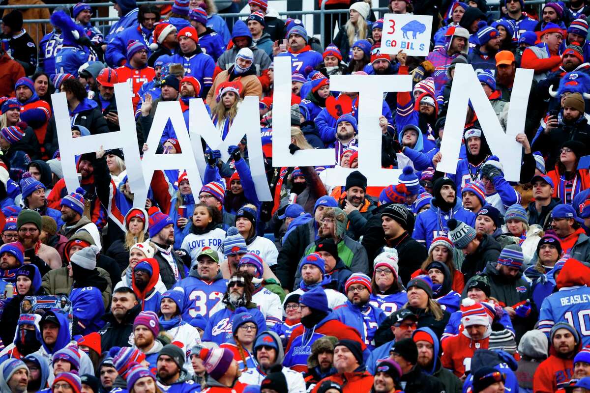 Fans hold a sign in support of Buffalo Bills safety Damar Hamlin during the second half of an NFL football game against the New England Patriots, Sunday, Jan. 8, 2023, in Orchard Park. Hamlin remains hospitalized after suffering a catastrophic on-field collapse in the team's previous game against the Cincinnati Bengals.