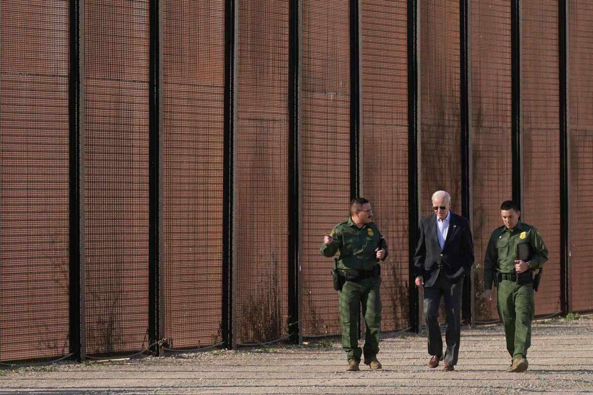 President Joe Biden walks with U.S. Border Patrol agents along a stretch of the U.S.-Mexico border in El Paso Texas, Sunday, Jan. 8, 2023.
