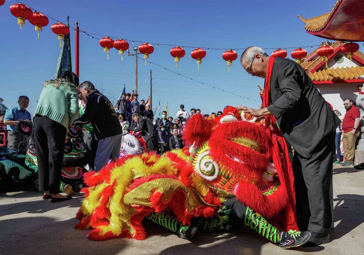 The eyes of the lions are dotted as part of a blessing ceremony celebrating the Ong Bon Festival on Sunday, Jan. 8, 2023 at Texas Teo Chew Temple in Houston. The purpose of the ritual is to empower the lion to fulfill its duty of bringing about protection, good luck, health, and prosperity to those present.