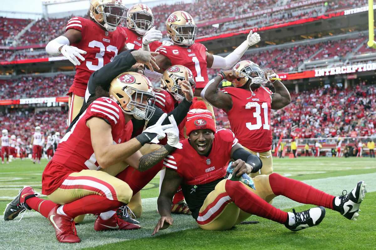 San Francisco 49ers’ Deebo Samuel celebrates with the defense after George Odum’s 4th quarter interception against Arizona Cardinals during Niners’ 38-13 win in NFL game at Levi’s Stadium in Santa Clara, Calif., on Sunday, January 8, 2023.