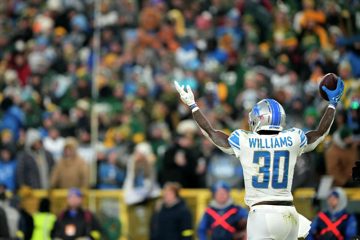 GREEN BAY, WISCONSIN - JANUARY 08: Jamaal Williams #30 of the Detroit Lions celebrates after scoring a touchdown during the fourth quarter against the Green Bay Packers at Lambeau Field on January 08, 2023 in Green Bay, Wisconsin. (Photo by Patrick McDermott/Getty Images)