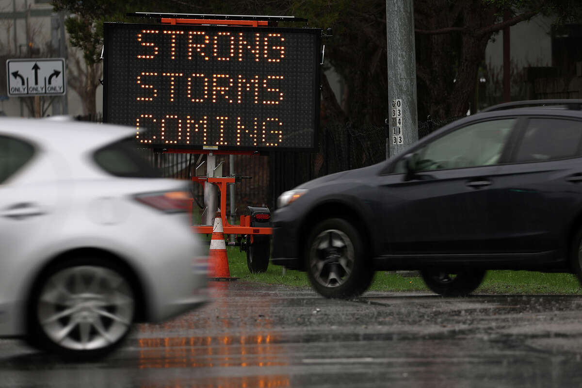 Cars thrust  by a motion   informing  of storms hitting the Bay Area connected  January 07, 2023 successful  Sausalito, California.