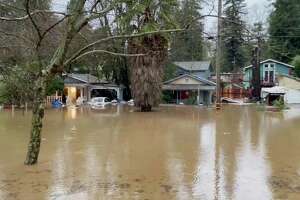 Santa Cruz storm: Intense rain inundates San Lorenzo River, flooding homes and roads