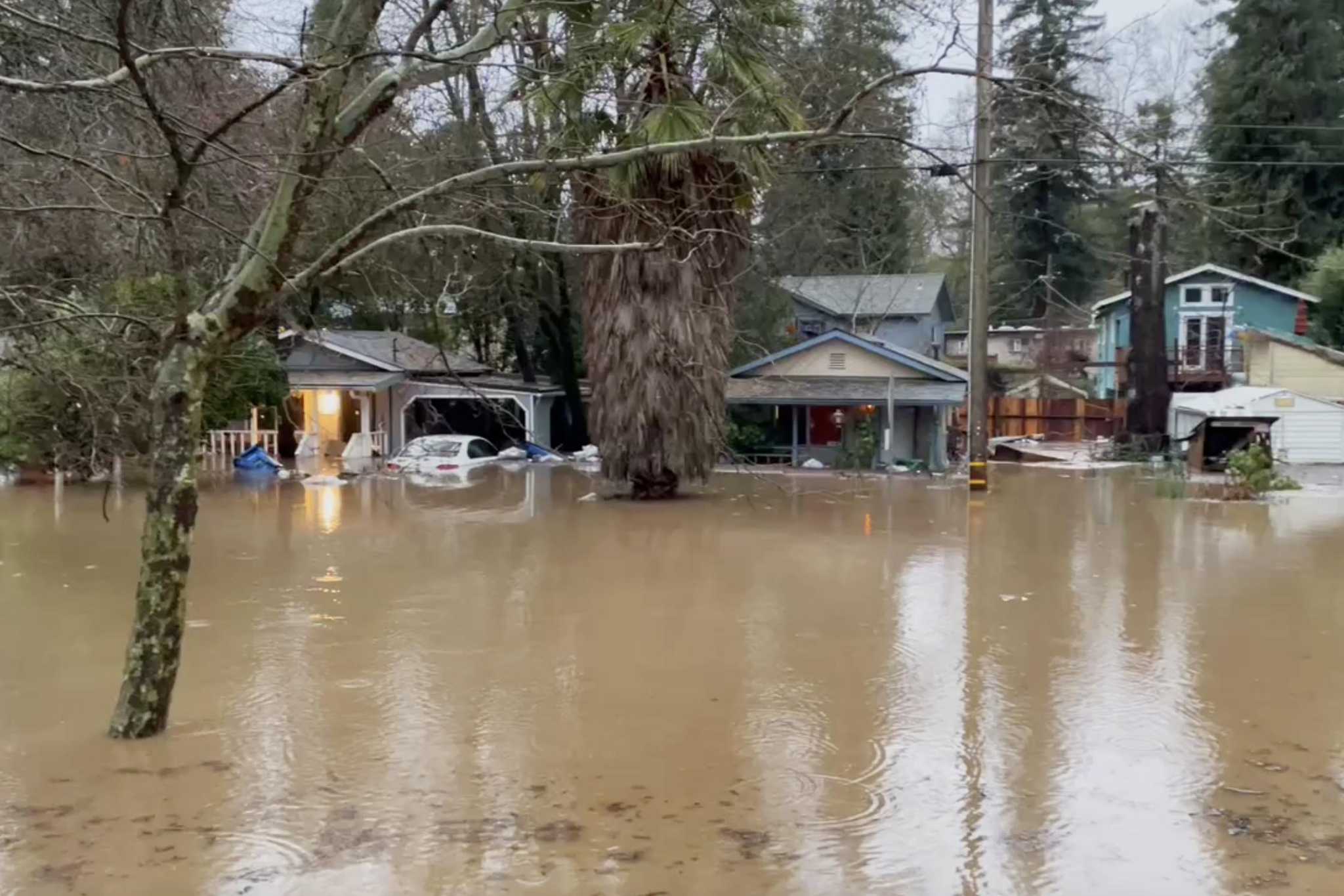Santa Cruz storm San Lorenzo River floods homes and roads