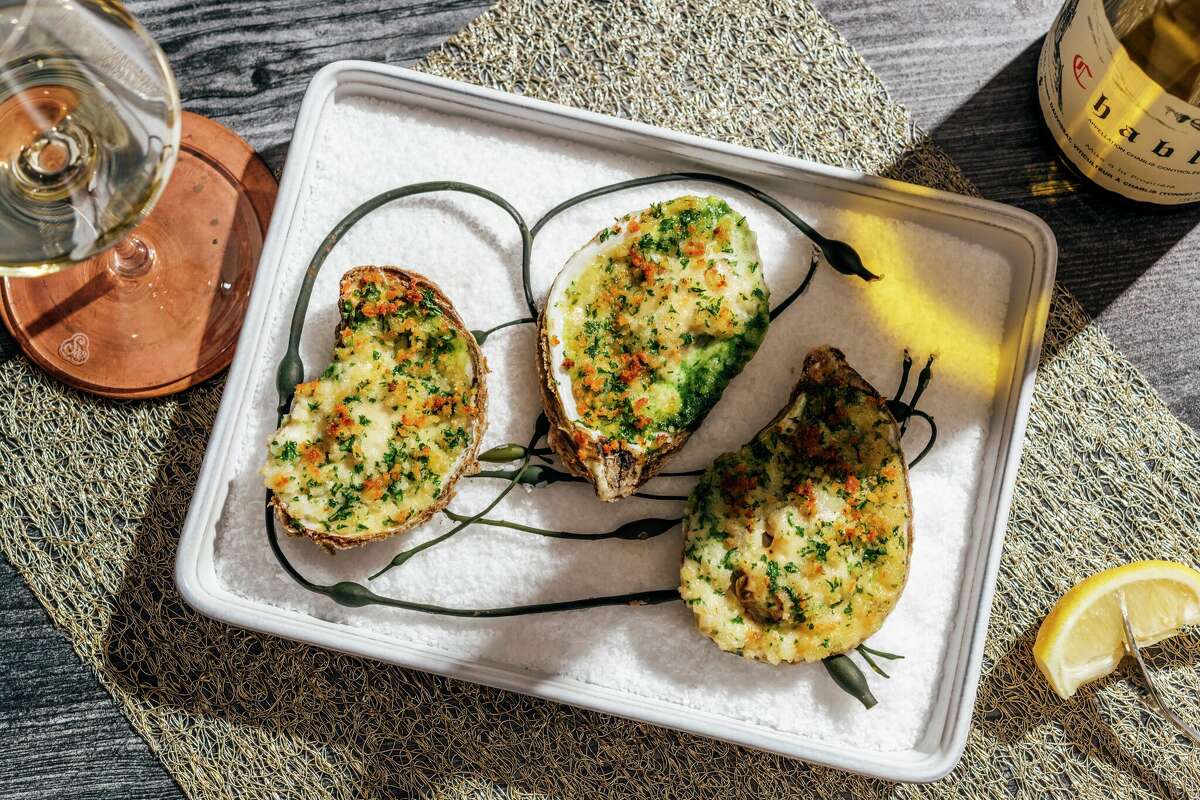 Baked Gulf oysters with spinach, absinthe and garlic soubise gruyere at Little's Oyster Bar.